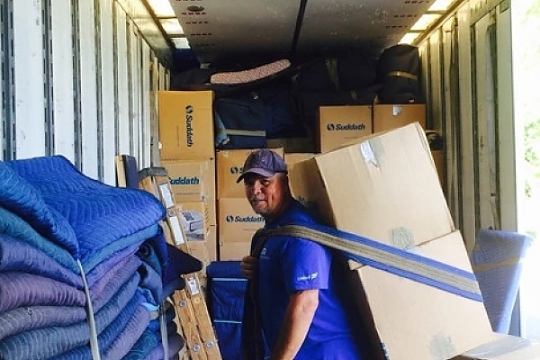 Experienced mover packing boxes into a truck for a residential move in Sarasota.