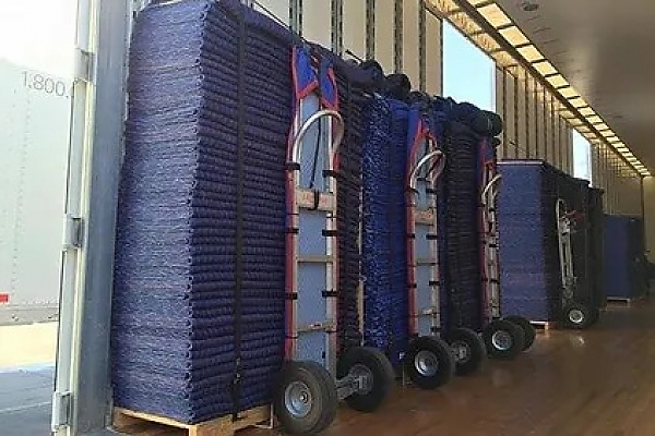 Dollies and moving pads organized in a moving truck for local moving services.